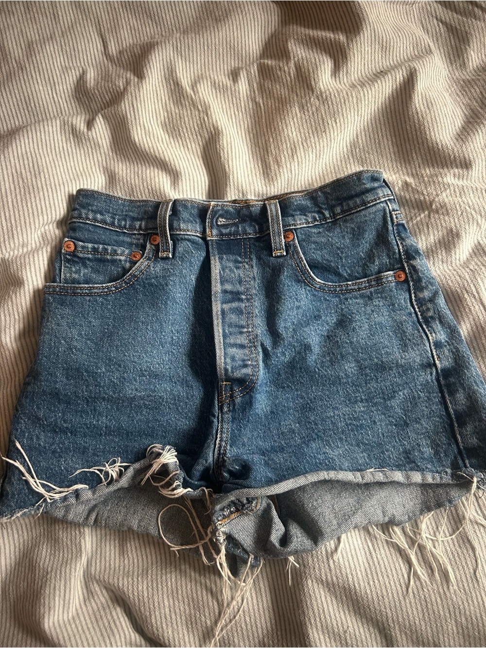 Levi's Medium Blue Denim Cutoff Shorts with Raw Hem - Picture 2 of 3